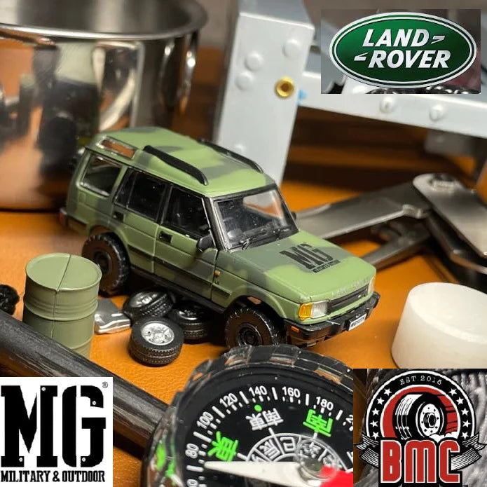 BM CREATIONS JUNIOR 1/64 Land Rover 1998 Discovery 1 Military Camouflage with Oil Tank (MG Edition) RHD